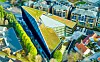 Sedumtak: Taket er dekket av sedum. Det er høyest med sju etasjer mot nord, mens bygget skråner nedover mot trehusbebyggelsen i sør. Foto: 3D4D.NO/SPAREBANK 1 SR-BANK