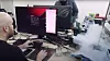 Fra forsøket på å overklokke en Intel Core i9-13900K-prosessor til mer enn 9 GHz. Til høyre i bildet er hovedkortet og prosessoren dekket av heliumdamp. Temperaturmåleren nederst i midten viser fortsatt høyere temperatur enn den som ble brukt da rekorden ble satt.