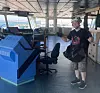 John-André Bjørkhaug på broen under et oppdrag. Bildet er brukt i foredraget hans «Pirates of the North Sea». Foto: Privat