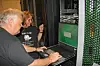 Systemadministrator Arve Dispen logger seg inn på terminalen til Vilje. I innloggingsvinduet går det klart fram at superdatamaskinen kjører SUSE Linux. Ved siden av Dispen står sjef for HPC-laben, Anne Cathrine Elster. Bilde: Harald Brombach