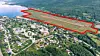 Store deler av området i rødt ble gitt bort gratis mot lovnader om 3 000 arbeidsplasser. Foto: Ballangen kommune