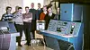Siffergruppen: Siffergruppen anno 1962 ved sin første maskin Lydia. Den besto av fire skap fulle av elektronikk‐kort. Fra venstre: Per Bugge‐ Asperheim, Svein Strøm, Per Klevan, Lars Monrad Krohn, Per Bjørge, Asbjørn Horn, Olav Landsverk, Yngvar Lundh.