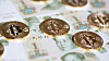 Bitcoins over the background made of Chinese yuan