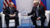 Mens Donald Trump har sagt at han tror på Vladimir Putin som sier at Russland ikke forsøkte å forstyrre den amerikanske valgkampen i 2016, er konklusjonen en annen når det gjelder NotPetya. Her er de to avbildet under G20-møtet i Hamburg i juli 2017, bare dager etter at NotPetya-angrepet brøt løs.