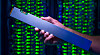 The ruler-shaped PCIe-based QLC Intel SSD D5-P4326 can hold up to 32 terabytes. As part a 1PB solution, it draws just one-tenth the power of a traditional spinning hard drive solution. (Credit: Walden Kirsch/Intel Corporation)