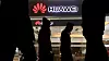 Pedestrians walk past a Huawei retail shop in Beijing Thursday, Dec. 6, 2018. China on Thursday demanded Canada release a Huawei Technologies executive who was arrested in a case that adds to technology tensions with Washington and threatens to complicate trade talks. (AP Photo/Ng Han Guan)