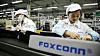 Arbeidere ved samlebåndet i en Foxconn-fabrikk i Kina som produserer iPhone.