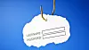 'Username and password' on a fishing hook. Conceptual image about the risk of internet identity theft, also known as 'Phishing'.
