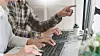 Pensive programmer working on desktop pc programming code technologies or website design at office S ...