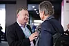 John Strand i passiar med Jon Fredrik Baksaas under mobilkongressen i Barcelona i 2017. Kongressen er en pengemaskin, og det aller største og viktigste av en rekke arrangementer i regi av næringsorganisasjonen GSMA. Bilde: Varog Kervarec