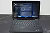 En ti år gammel Dell Latitude E7240 Ultrabook kjører Windows 11 til tross for at den offisielt ikke støttes av operativsystemet.