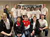 Landslaget fikk dessverre ikke konkurrert i årets European Security Challenge. Bildet viser laget med trenerne (f.v.) Mudassar Yamin og Laszlo Erdodi i røde T-skjorter. Foto: NTNU Gjøvik